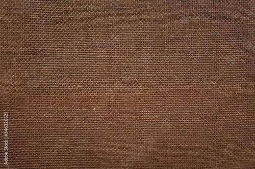 Background in brown color with a texture of thick linen canvas