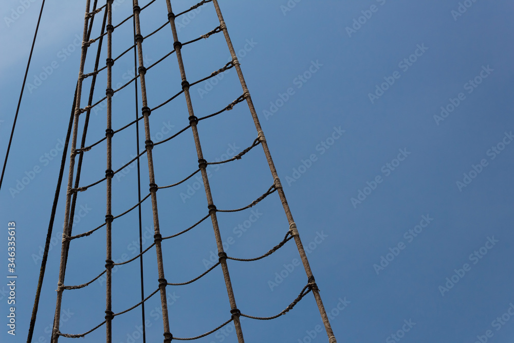 Detail of a shroud on an old tall ship, elaborate splicing and wound finish, sailing vessel rigging, horizontal aspect Detail of a shroud on an old tall ship, elaborate splicing and wound finish, sailing vessel rigging, horizontal aspect