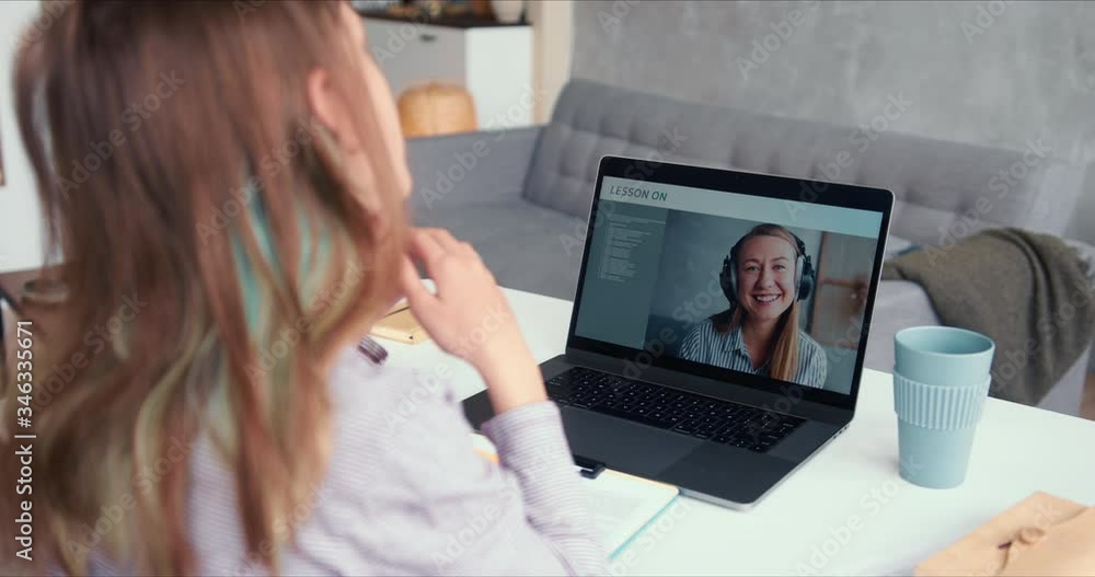 E-learning during quarantine vacation. Teen age girl speaks to private female teacher on laptop web conference call app. E-learning during quarantine vacation. Teen age girl speaks to private female teacher on laptop web conference call app.
