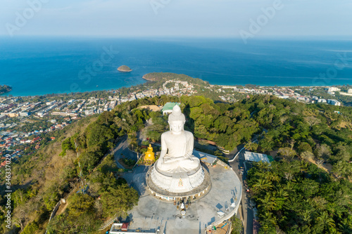 Vesak day background concept of Big buddha over high mountain in Phuket thailand Aerial view drone shot.