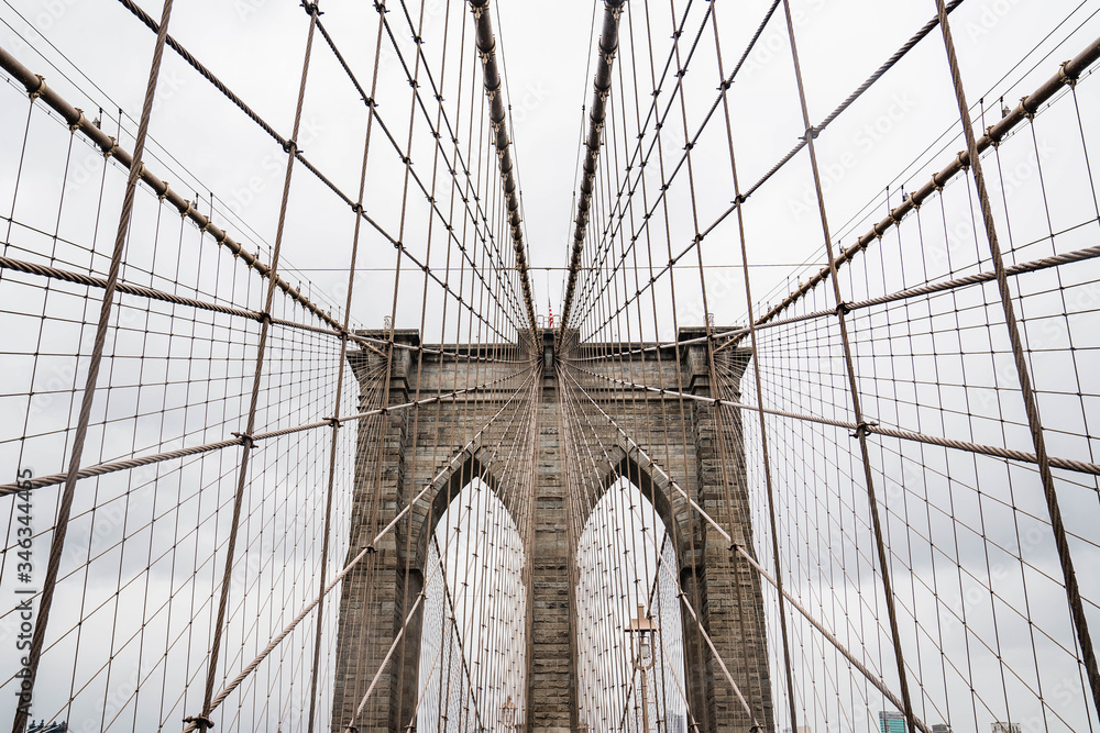 Fototapeta premium Brooklyn bridge. Rainy Brooklyn bridge view. Brooklyn bridge close up view. Rainy day at Brooklyn bridge. 