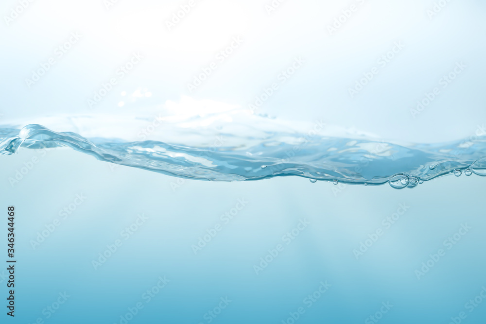 Water splash on blue background. Aqua flowing in waves and creating bubbles. Drops on the water surface feel fresh and clean. Water splash on blue background. Aqua flowing in waves and creating bubbles. Drops on the water surface feel fresh and clean.