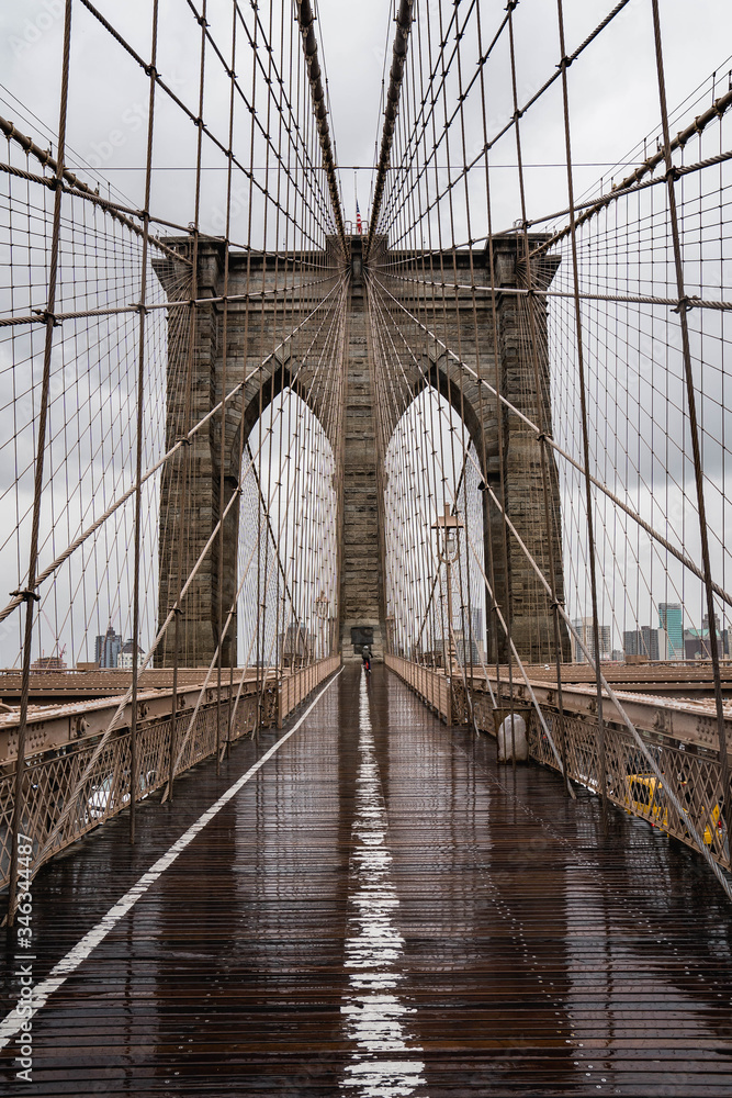 Fototapeta premium Brooklyn bridge. Rainy Brooklyn bridge view. Brooklyn bridge close up view. Rainy day at Brooklyn bridge. 