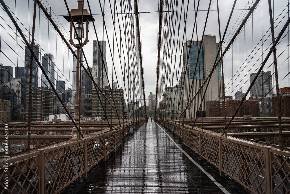Fototapeta premium Brooklyn bridge. Rainy Brooklyn bridge view. Brooklyn bridge close up view. Rainy day at Brooklyn bridge. 