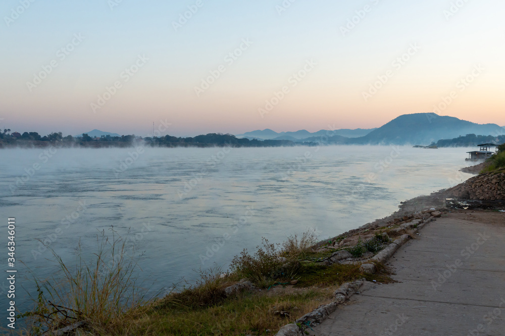 The landscape of the Mekong River in the morning in winter, mist from the rivers and mountains. The landscape of the Mekong River in the morning in winter, mist from the rivers and mountains.