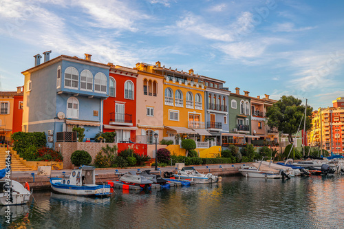 small Citi with big canal and lot of boats close to houses , look like Venice , Port Saplaya ,Alaboraya, Spain  