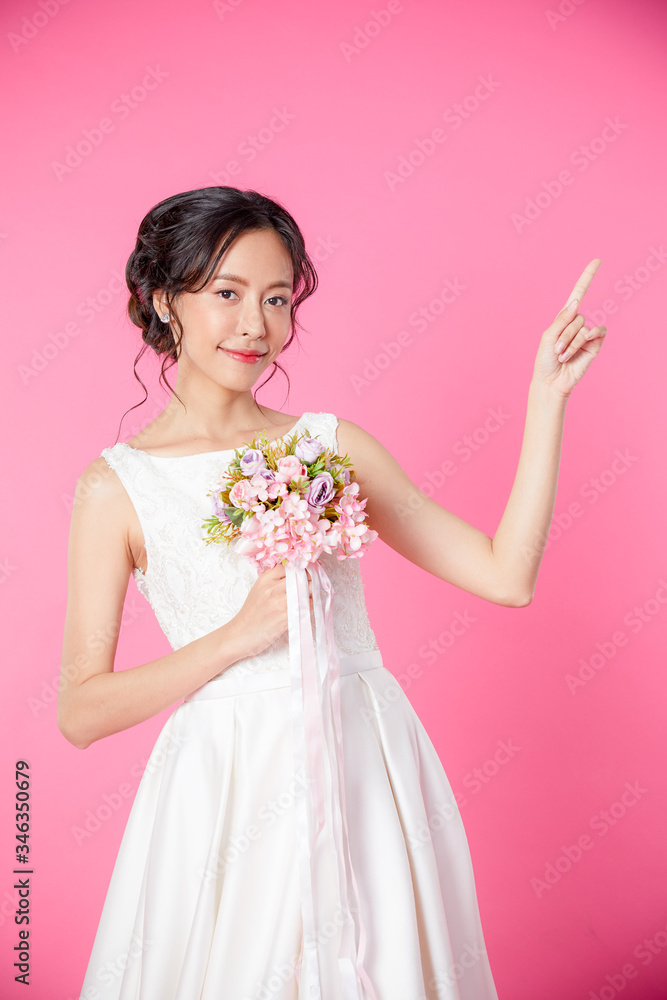 Look here, advertisement. Happy woman smiling showing look here at copy space at my text, product gesture with hand, isolated pink background. concept advertisement. Look here, advertisement. Happy woman smiling showing look here at copy space at my text, product gesture with hand, isolated pink background. concept advertisement.