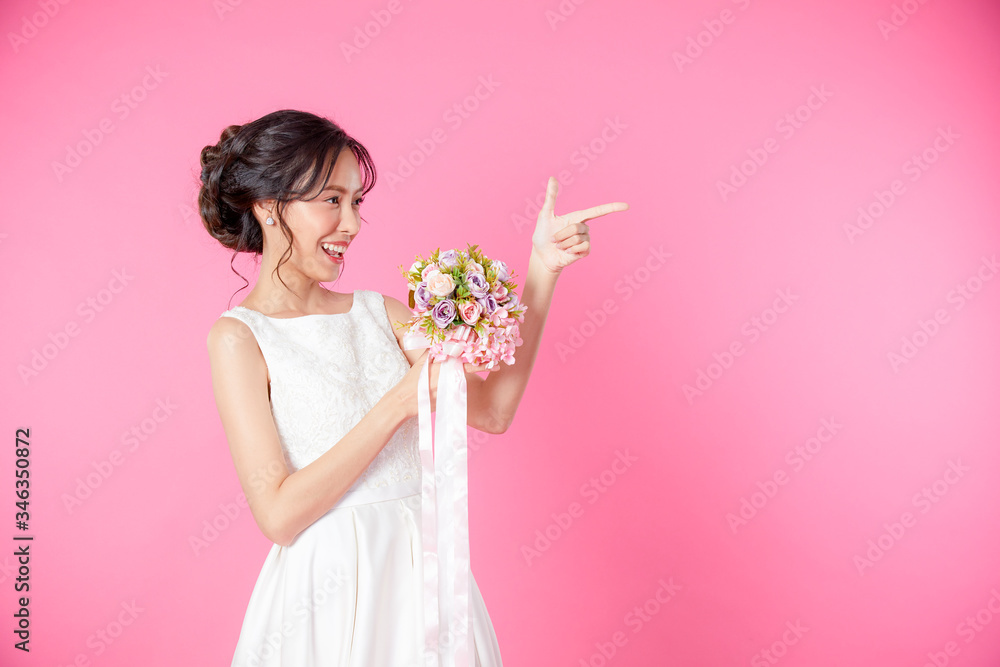 Look here, advertisement. Happy woman smiling showing look here at copy space at my text, product gesture with hand, isolated pink background. concept advertisement. Look here, advertisement. Happy woman smiling showing look here at copy space at my text, product gesture with hand, isolated pink background. concept advertisement.