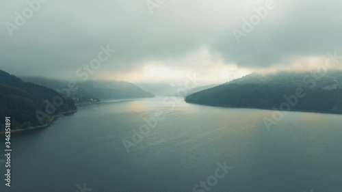 Izvorul Muntelui Reservoir - Flying over lake, between montains - Dolly in photo