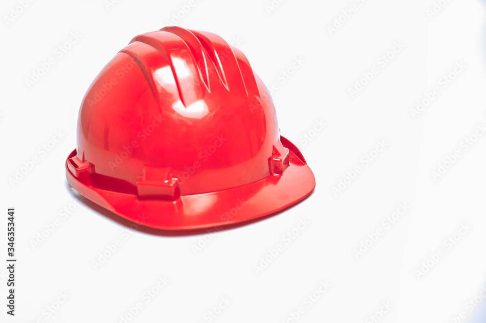 Fototapeta premium Red workman's helmet on white background