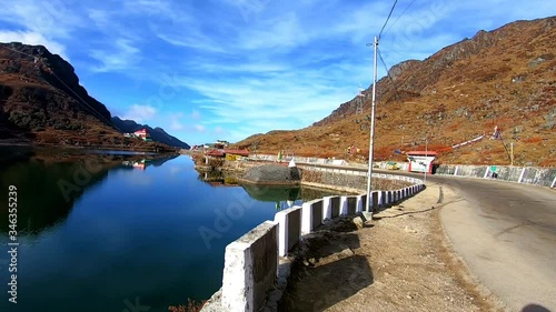 lake blue water surrounded by pristine beautiful mountain photo