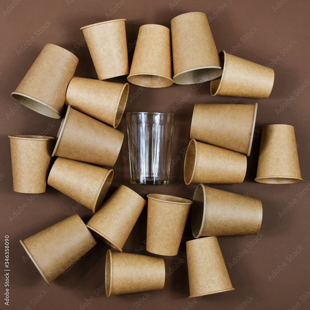 Zero waste concept. Eco-friendly, disposable, cardboard, paper dishes against glass reusable dishes. Zero waste concept. Eco-friendly, disposable, cardboard, paper dishes against glass reusable dishes.