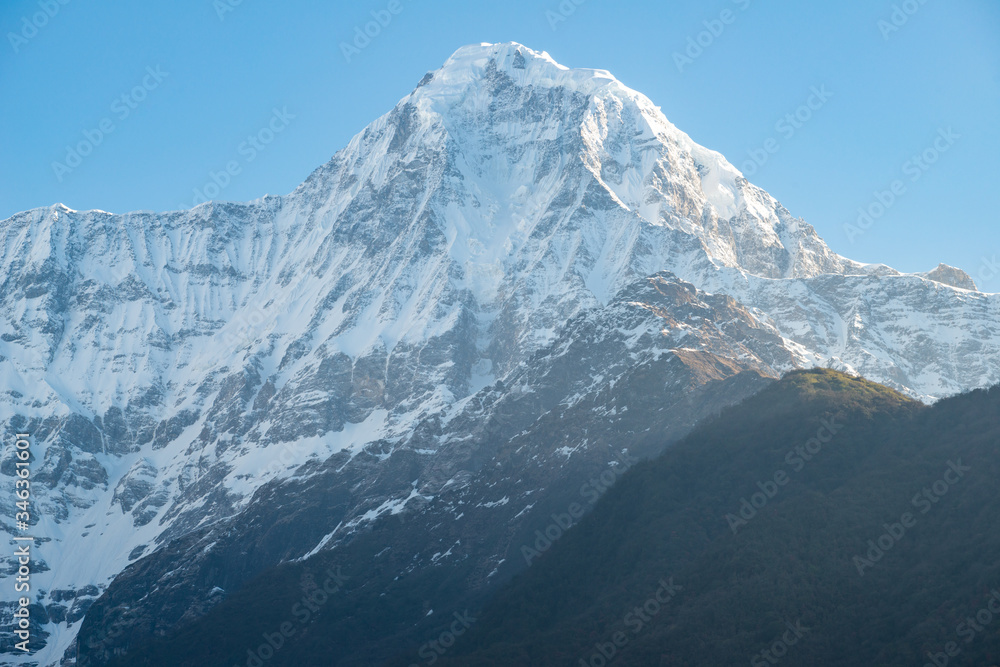 Obraz premium Beautiful view of Mt.Hiunchuli (6,441 metres) view from Chomrong village on the way to Annapurna Base Camp, Nepal. Hiunchuli is a peak situated in the Annapurna massif.