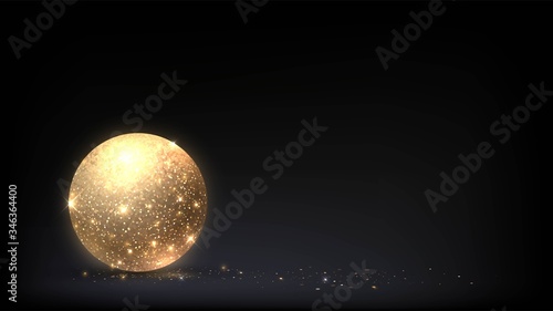 Glittering golden ball on a dark background, sparkling gold