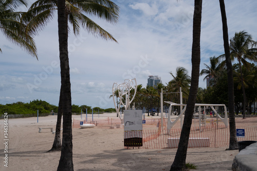 MIAMI, USA - MAY 3, 2020: FREE Gym Miami My Equilibria, South Beach. Calisthenics Public Gym. Ocean Drive, by the beach. Florida Public sport. A beach workout at a free gym in the great outdoors. photo