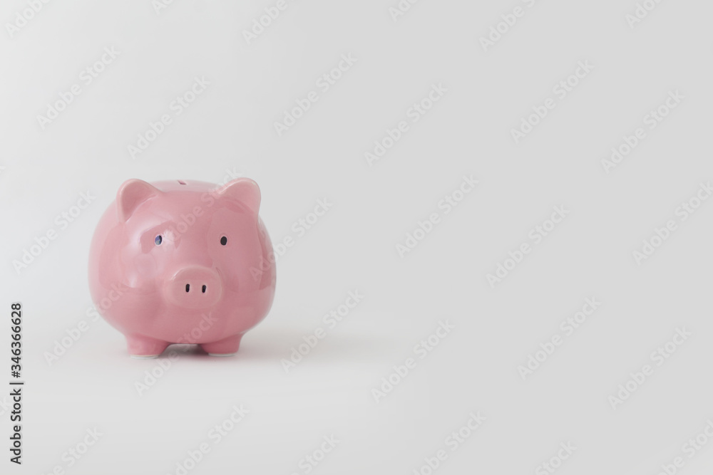 Close-up of pink piggy bank stands on white background Close-up of pink piggy bank stands on white background