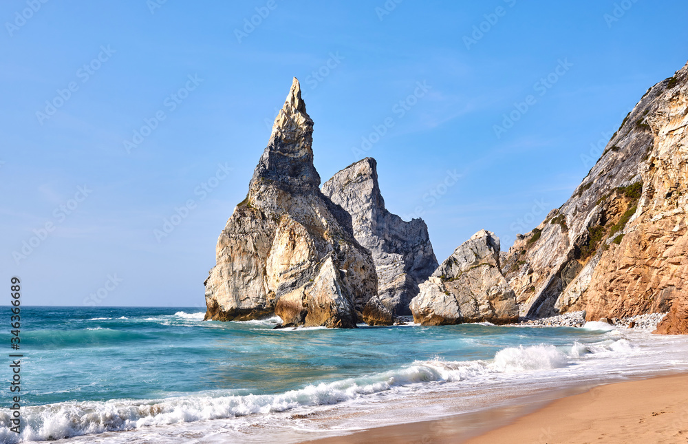 wild sandy beach on the ocean with rocks in sunny weather wild sandy beach on the ocean with rocks in sunny weather