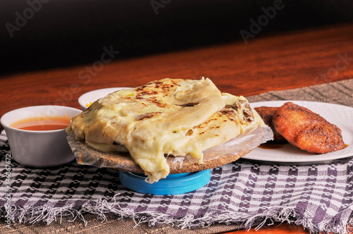 Close up photo of pupusas dish with nuegados, a traditional meal from El Salvador photo