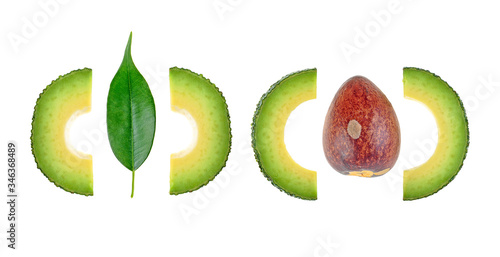 Healthy food. Avocado slices with leaf and bone on white background. Food concept.