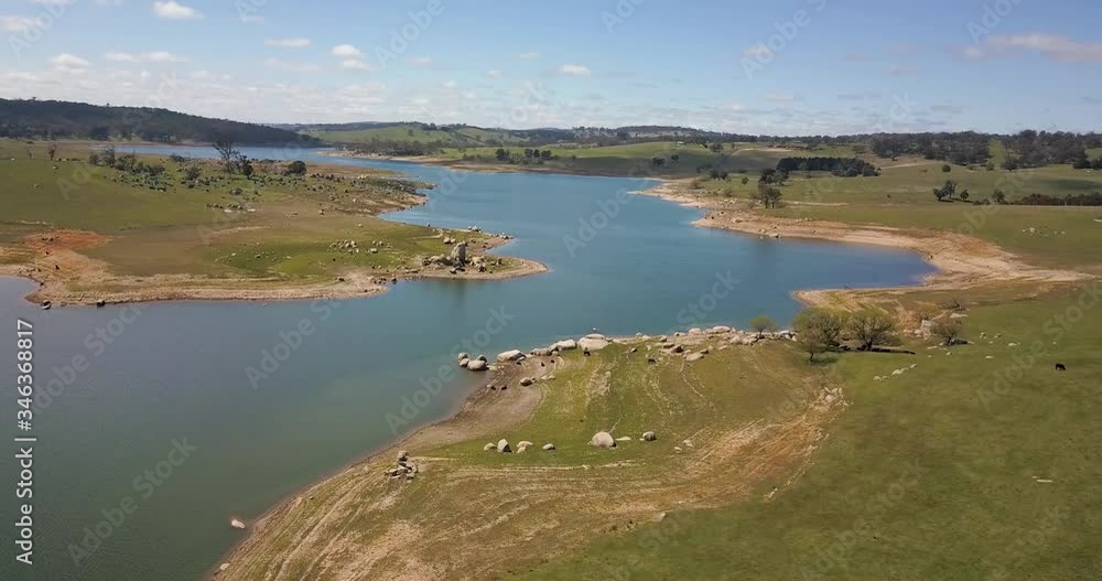 Drone orbit descending towards twisting lake, Australian countryside Drone orbit descending towards twisting lake, Australian countryside