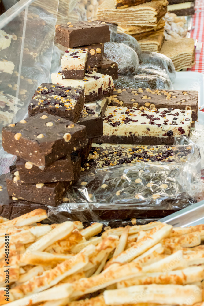 Sweet pastry, candies, homemade black and white chocolate with nuts and seeds