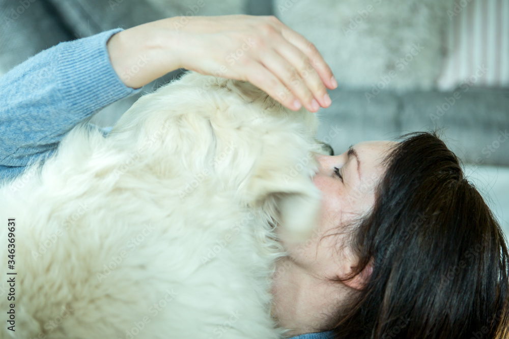 Woman with golden retriever dog at home Woman with golden retriever dog at home