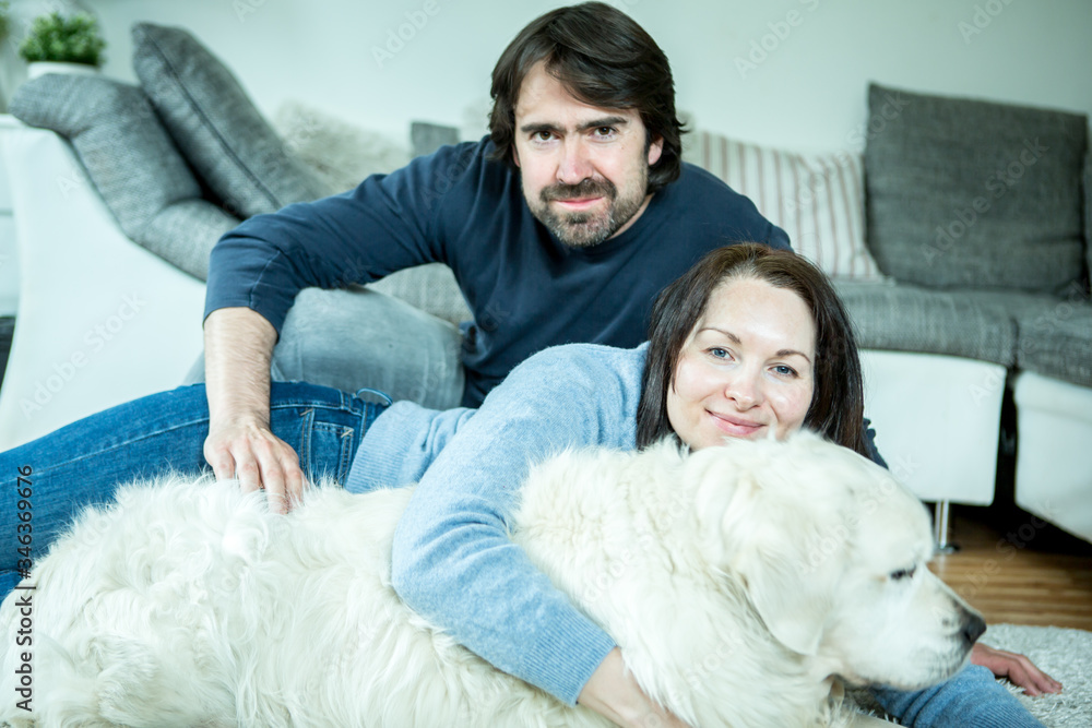 Young couple with dog at home Young couple with dog at home