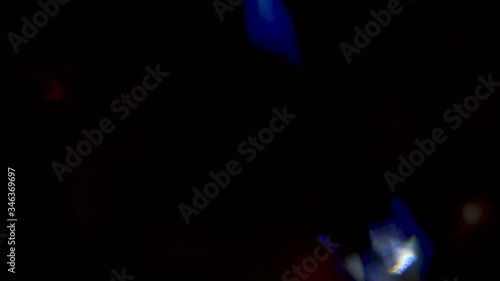 Leaking Reflection of a Glass / Crystal Making Colorful Abstract Prism Figures. Real lens flares perfect for abstract motion background.