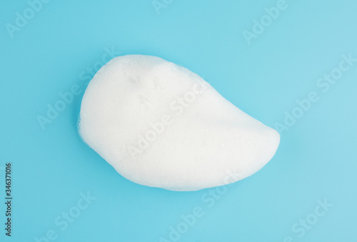Soap foam shampoo bubble isolated on blue background object beatuy health care concept