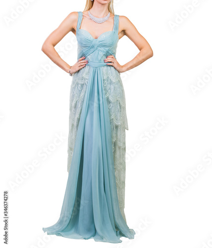 Beautiful woman dressed in evening gown over white background