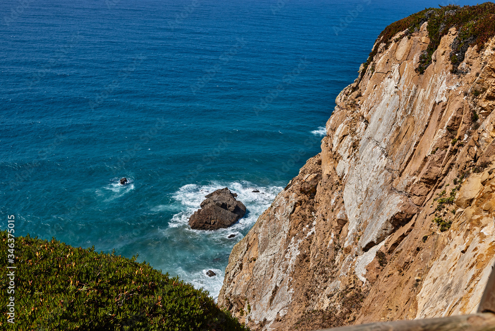 rocky landscape in the atlantic ocean. rocky cliff into the ocean portugal.