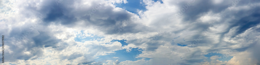 Blue sky panorama with storm cloud on a cloudy day. Beautiful 180 degree panoramic image. Blue sky panorama with storm cloud on a cloudy day. Beautiful 180 degree panoramic image.