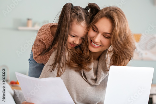 Working mother with little ...