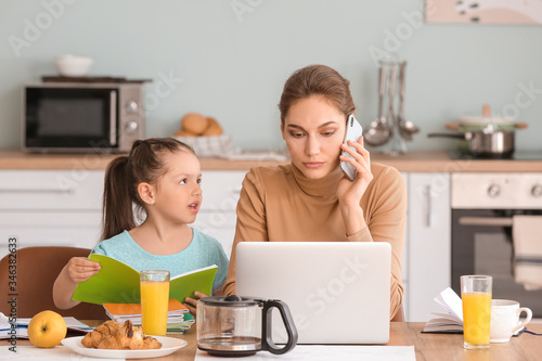 Working mother with little ...