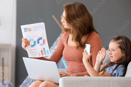 Working mother with little ...