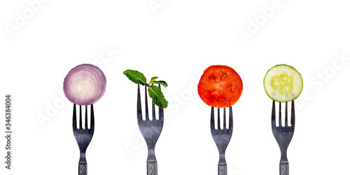 onion, tomato in spoon isolated on white background,