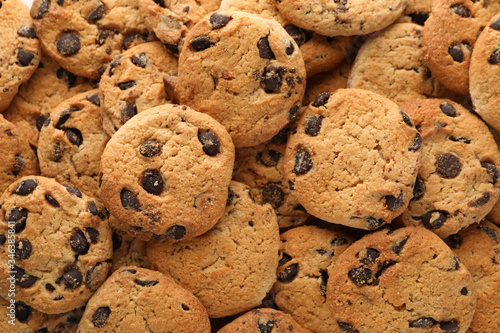 Chocolate chip cookies on whole background. Texture background