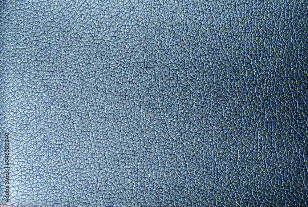 Faux leather texture in metallic blue. Artificial leather close-up Faux leather texture in metallic blue. Artificial leather close-up