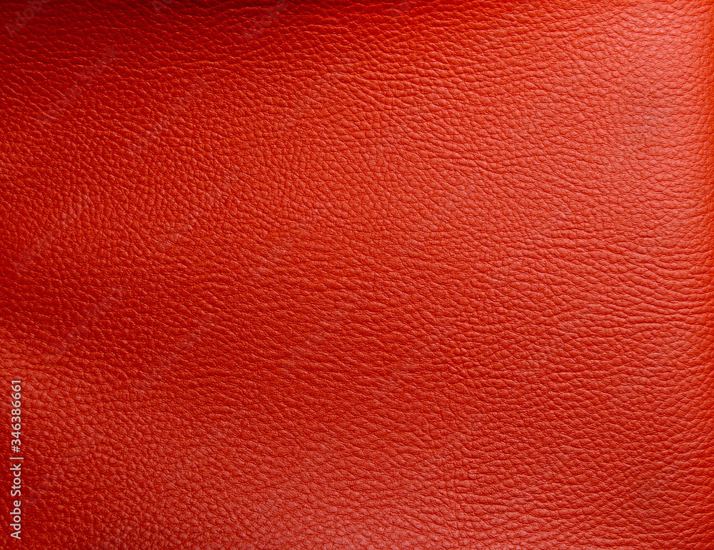 Fototapeta premium Orange faux leather. Faux leather texture close up