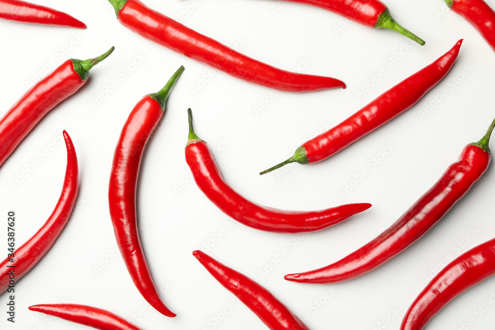 Flat lay with chilli peppers on white background, top view Flat lay with chilli peppers on white background, top view