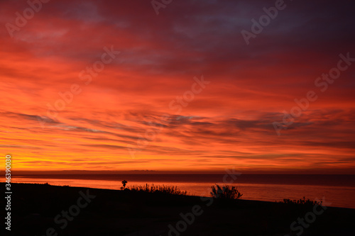 Bloody sunrise at Spanish beach. Torrox Costa