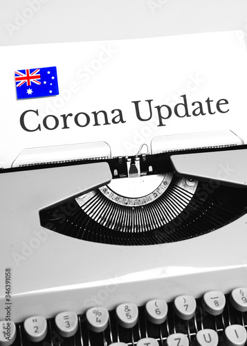 A Typewriter Typing the NEWS of COVID-19 with the Flag of Australia.