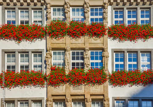 Traditional building with flowers on the balcony in Munich, Germany © Vladislav Gajic
