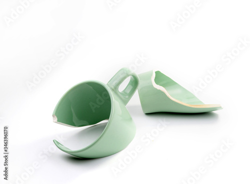 Broken coffee mug on white background, broken cup pieces, Broken relationship and Parting concept