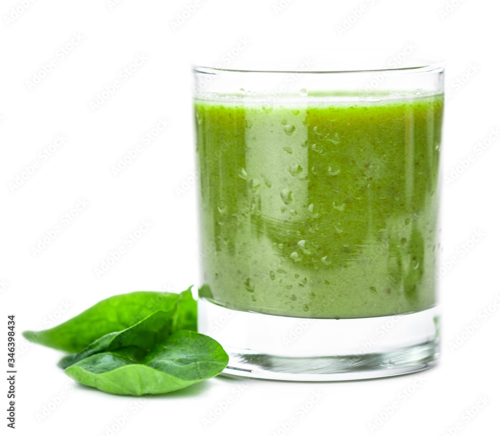 Homemade spinach smoothie isolated on white (close up; selective focus) Homemade spinach smoothie isolated on white (close up; selective focus)