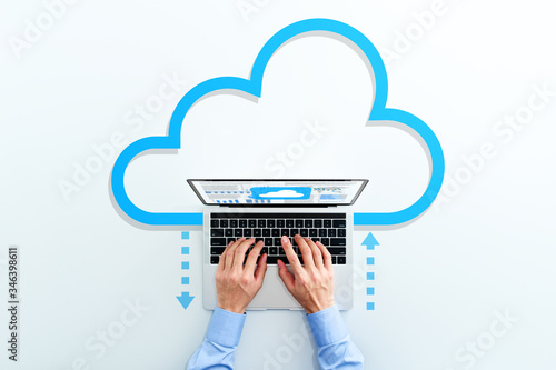 Cloud computing technology. Business man using laptop. Upload and download files. photo