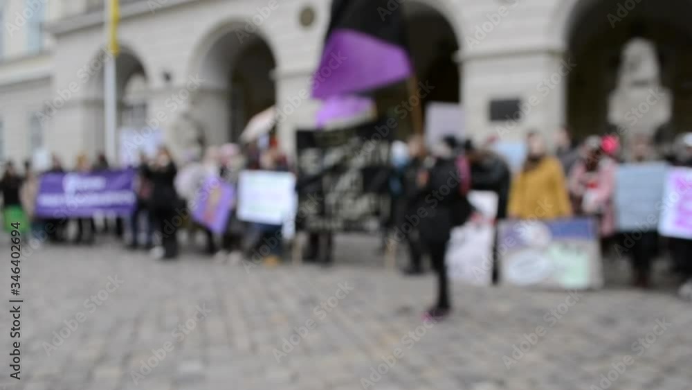 Blurred background People are standing in the square in protest. Blurred background People are standing in the square in protest.