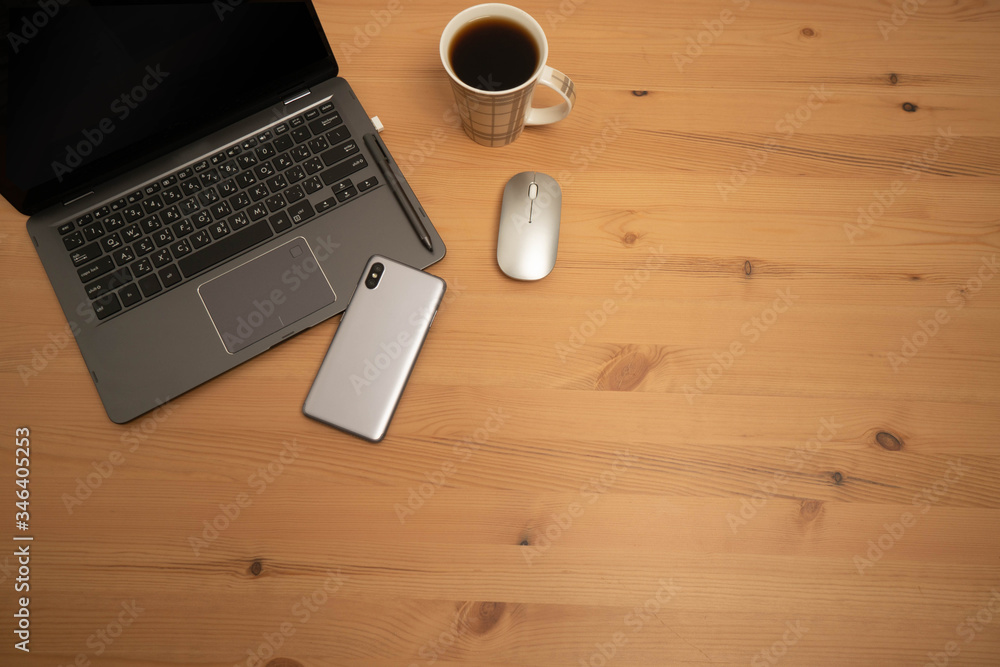 laptop, mobile phone and coffee cup on wooden table laptop, mobile phone and coffee cup on wooden table