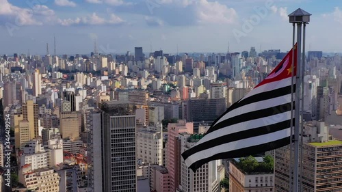 Aerial view of Altino Arantes building, called Banespao with the flag fluttering, Sao Paulo downtown, Brazil photo