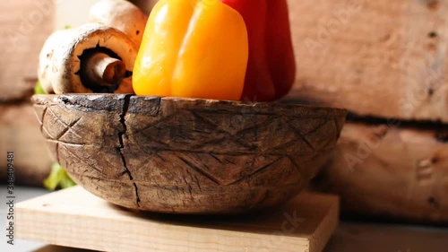 vegetable still life, made with mushrooms, red pepper, yellow pepper, coriander, on a wood bowl,Dolly Out camera movement, tansition photo
